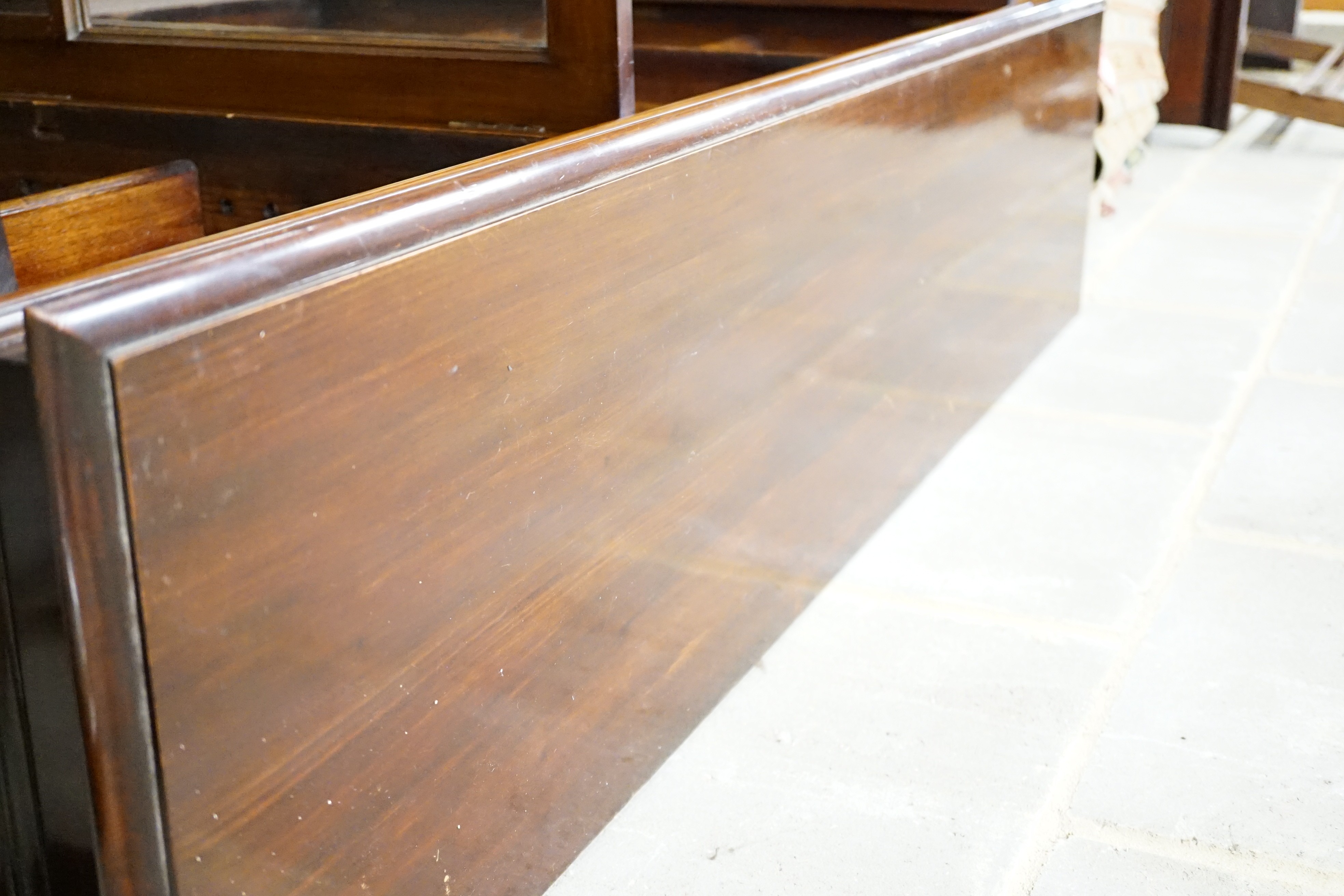 An Edwardian carved mahogany dwarf bookcase, width 153cm, height 116cm